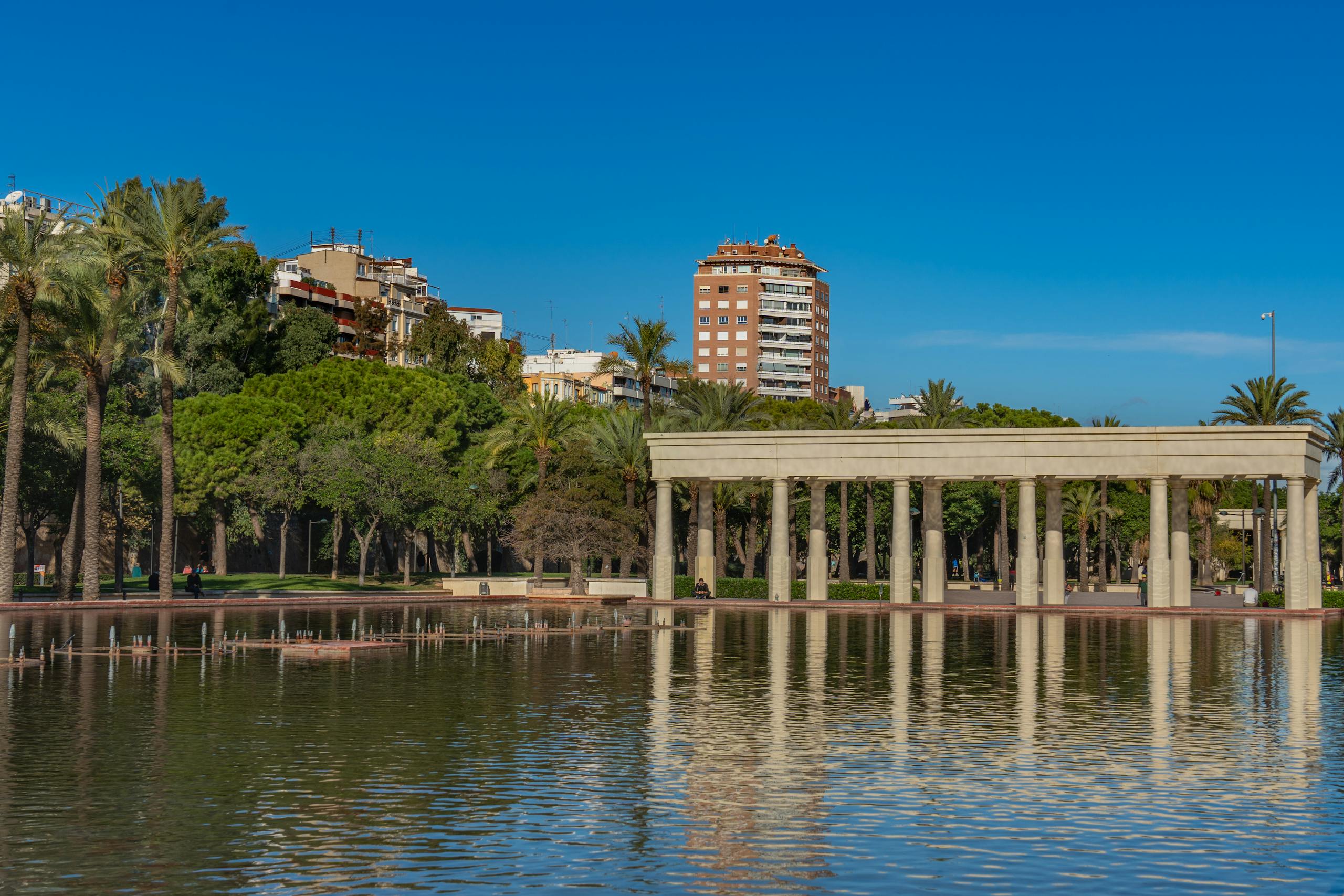 Beautiful scene of Turia Gardens and architecture in Valencia on a sunny day.